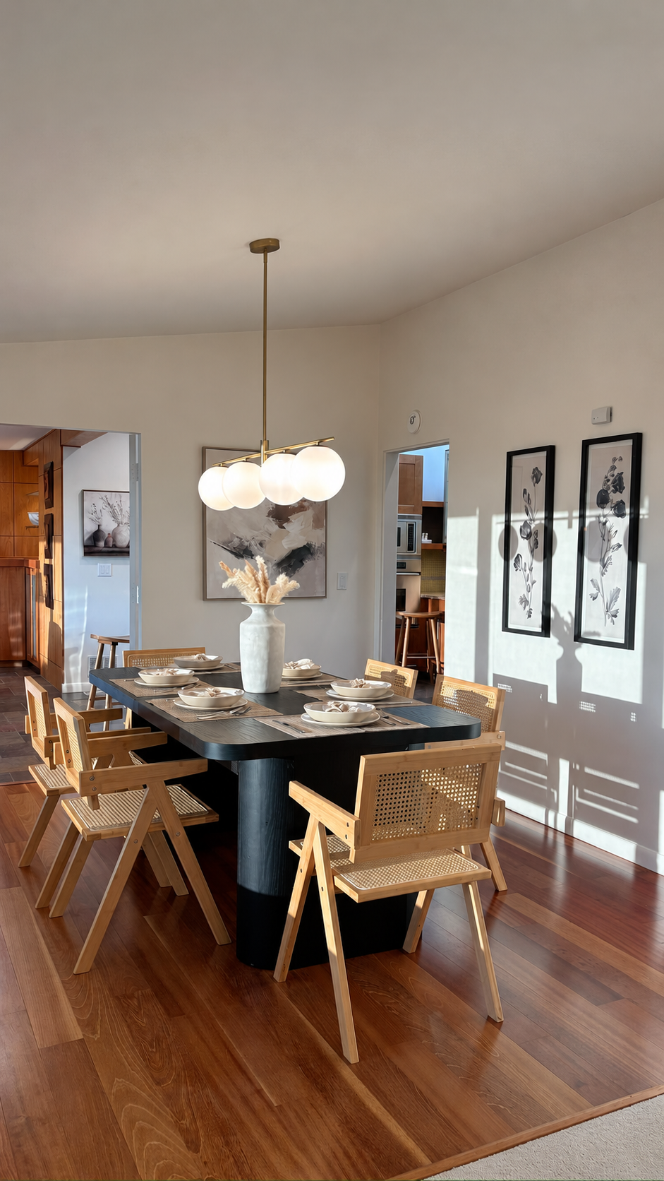 Dining room with cane chairs and warm sunlight
